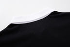 MAJESTIK Sports Embroidered Patch Half‑Zip Black‑White Polo Shirt