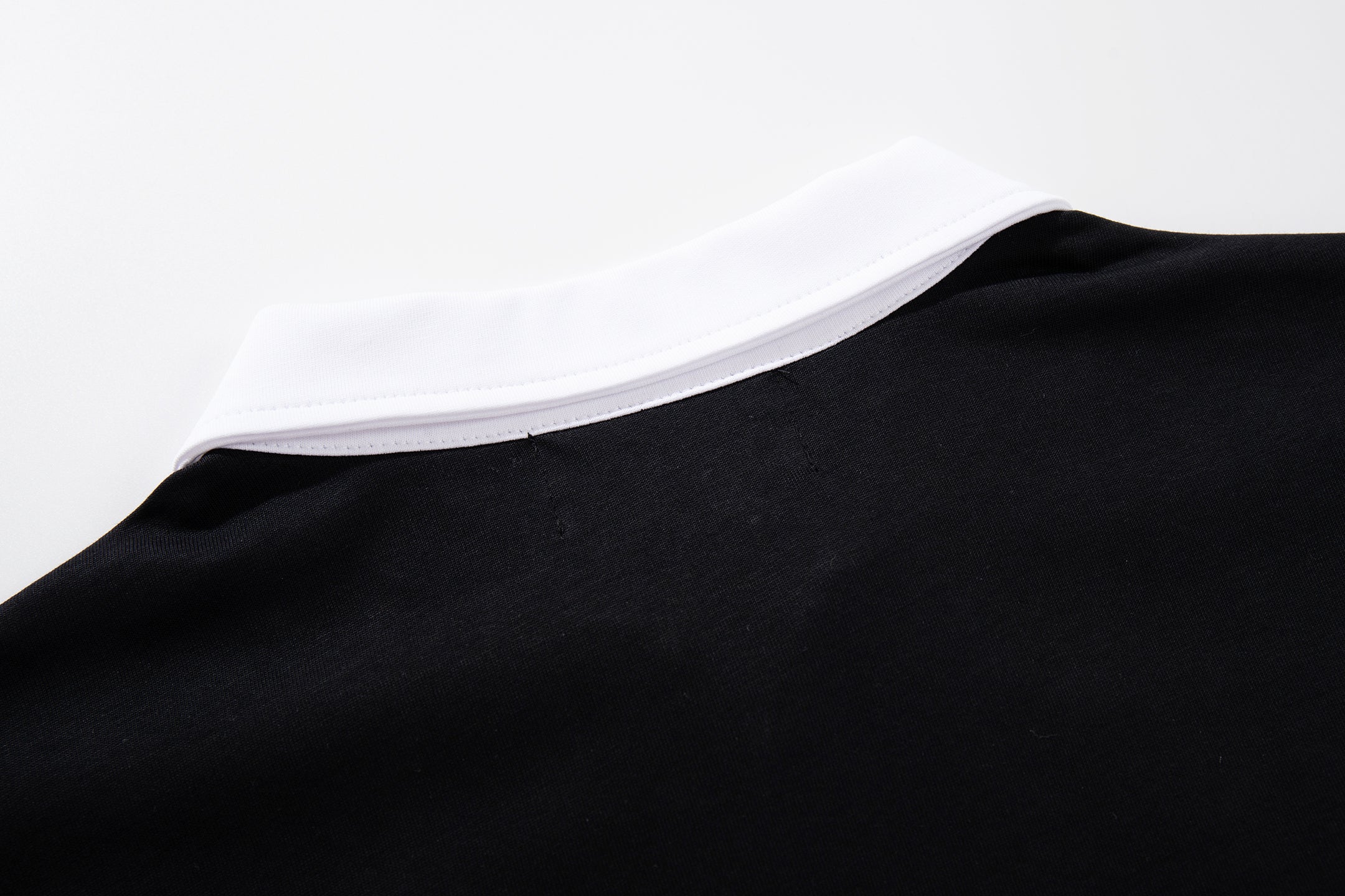 MAJESTIK Sports Embroidered Patch Half‑Zip Black‑White Polo Shirt