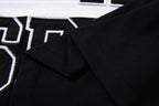 MAJESTIK Sports Embroidered Patch Half‑Zip Black‑White Polo Shirt