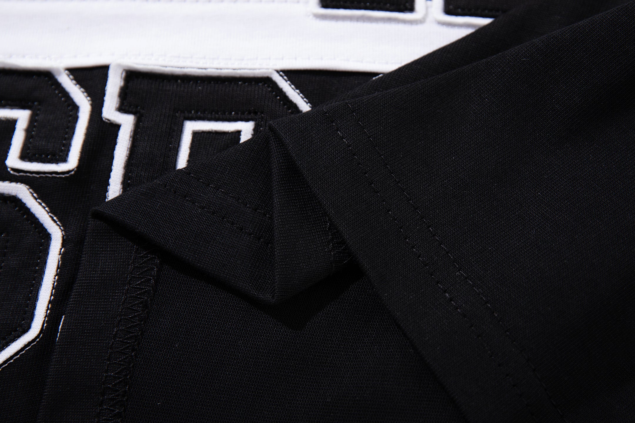 MAJESTIK Sports Embroidered Patch Half‑Zip Black‑White Polo Shirt