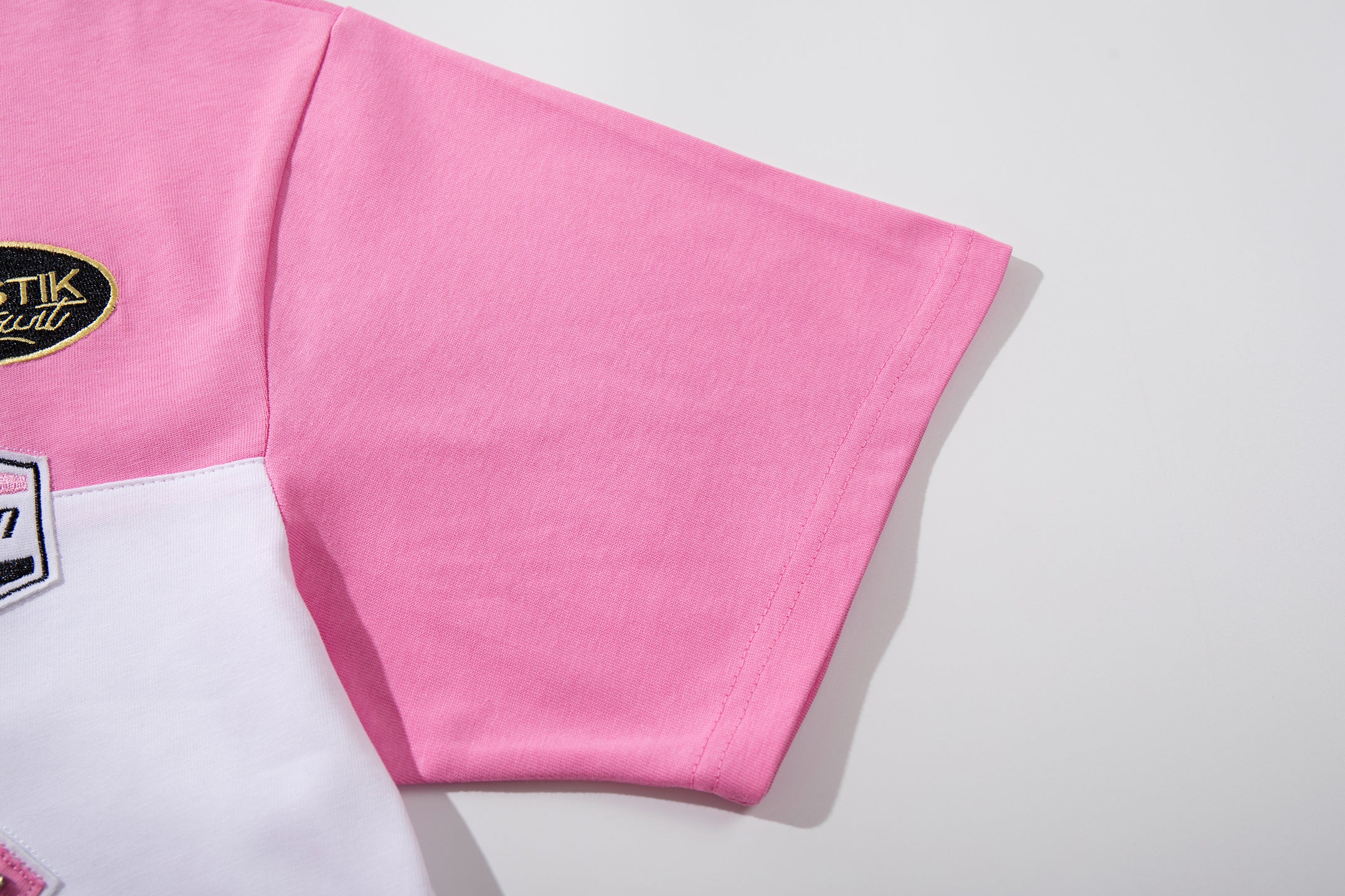 MAJESTIK Sports Patch‑Embroidered Half‑Zip Pink Striped Polo Shirt