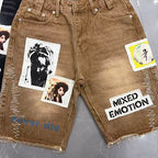 MIXED EMOTION Photo‑Patch Raw‑Hem Denim Shorts