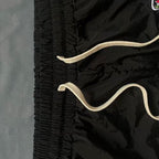 MIXED EMOTION Side‑Striped Rhinestone Logo Nylon Shorts