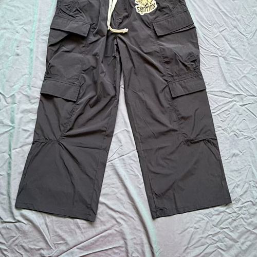 MIXED EMOTION Crest Patch Wide‑Leg Cargo Pants