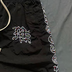 MIXED EMOTION Side‑Striped Rhinestone Logo Nylon Shorts