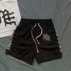 MIXED EMOTION Side‑Striped Rhinestone Logo Nylon Shorts