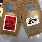 MIXED EMOTION Photo‑Patch Raw‑Hem Denim Shorts
