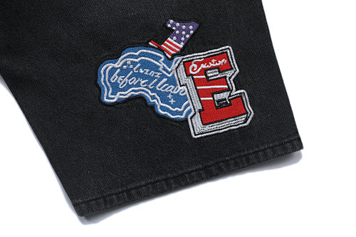 MIXED EMOTION Multi‑Patch Gothic Logo Black Denim Jorts