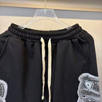 MIXED EMOTION Wing‑Pattern Side Wide‑Leg Sweatpants