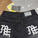 MIXED EMOTION Photo‑Patch Raw‑Hem Denim Shorts