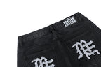MIXED EMOTION Multi‑Patch Gothic Logo Black Denim Jorts