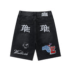 MIXED EMOTION Multi‑Patch Gothic Logo Black Denim Jorts
