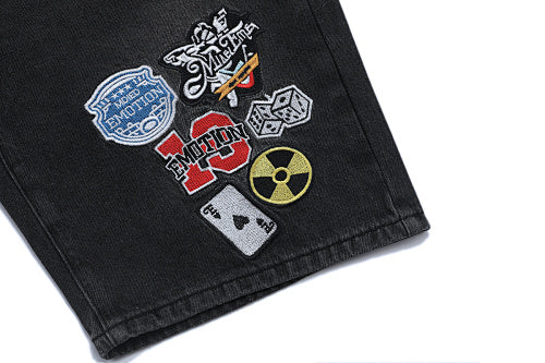 MIXED EMOTION Multi‑Patch Gothic Logo Black Denim Jorts