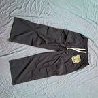 MIXED EMOTION Crest Patch Wide‑Leg Cargo Pants