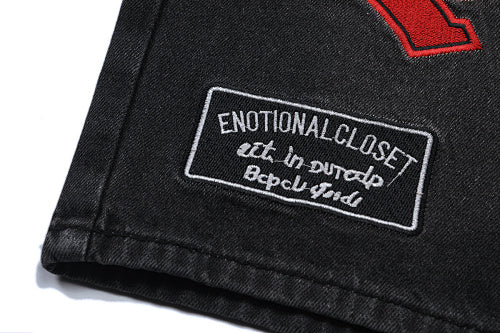 MIXED EMOTION Multi‑Patch Gothic Logo Black Denim Jorts